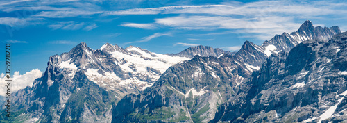 Switzerland, Panoramic view on Grindelwald valley and Wetterhorn and green Alps around