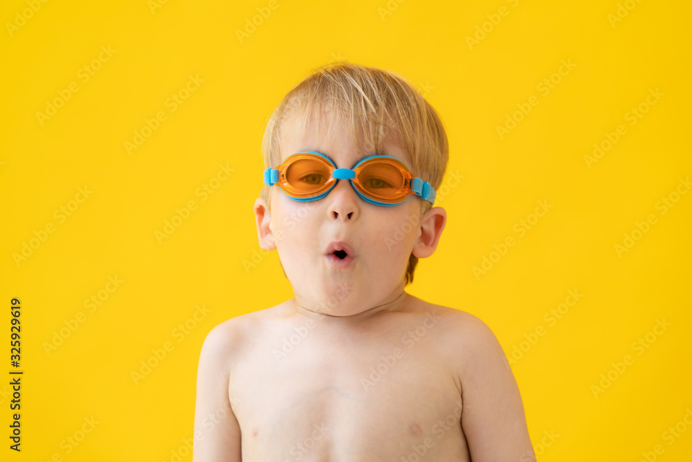 Portrait of happy child wearing swimming goggles Portrait of happy child wearing swimming goggles