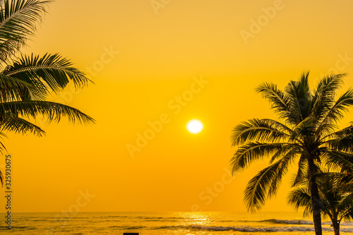 Fototapeta Naklejka Na Ścianę i Meble -  Beautiful nature with palm tree around sea ocean beach at sunset or sunrise