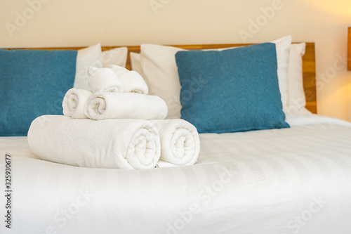 White clean bath towel on bed decoration interior