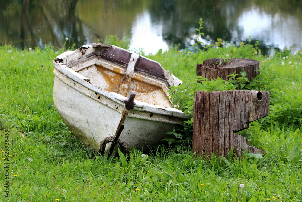 Abandoned vintage retro rustic old fiberglass river boat with cracked ...