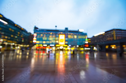 Helsinki night lights  Multi-colored neon shop windows and shopping center lights. Abstract blurred background. Shopping and sale in Finland concept