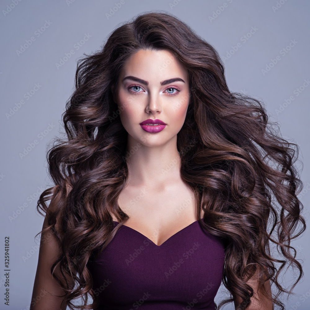 Face Of A Beautiful Woman With Long Brown Curly Hair Fashion Model With Wavy Hairstyle
