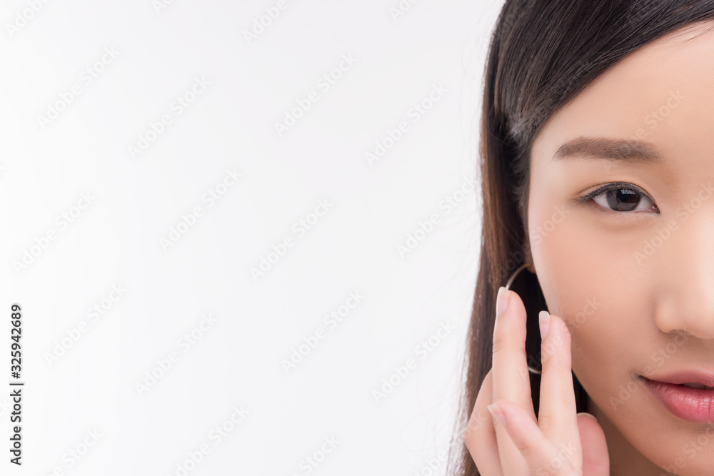 Beautiful Young Woman with Clean Fresh Skin. Face care . Facial treatment . Cosmetology , beauty and spa. Asian women portrait Beautiful Young Woman with Clean Fresh Skin. Face care . Facial treatment . Cosmetology , beauty and spa. Asian women portrait