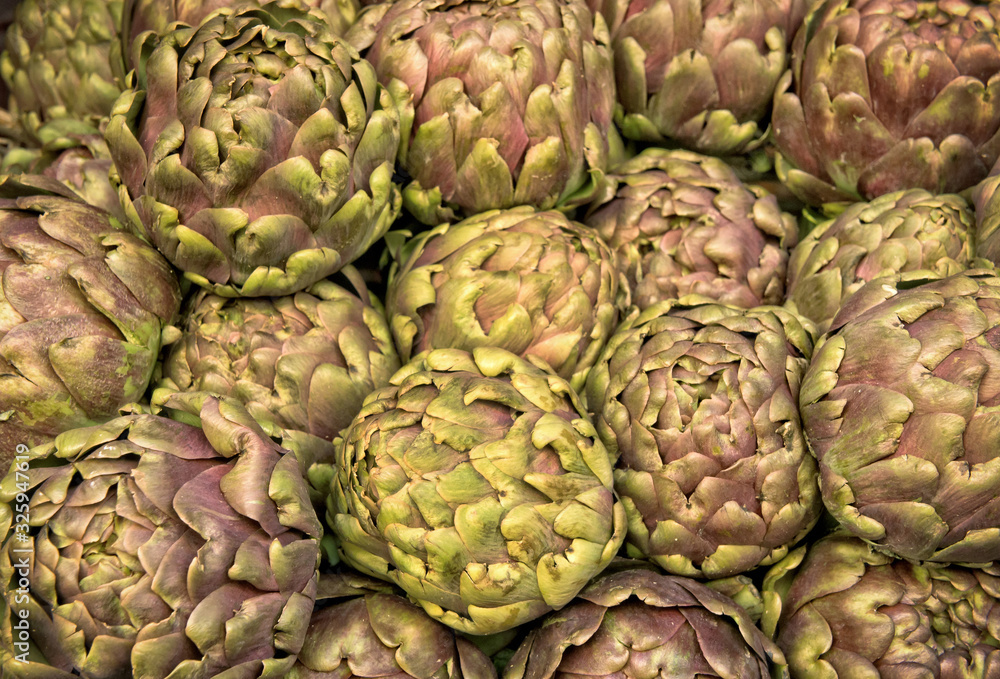 Group of artichokes at the market background Group of artichokes at the market background