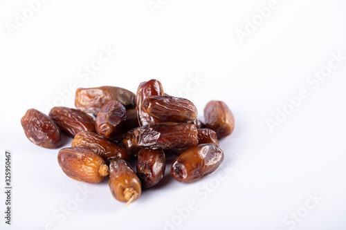 Oriental dates in the middle on white backdrop. 