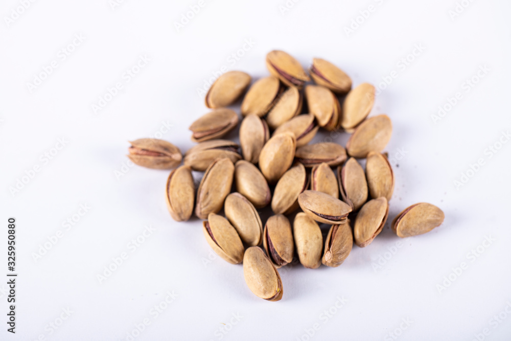 Pistachios in the middle of a white background Pistachios in the middle of a white background