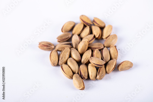Pistachios in the middle of a white background