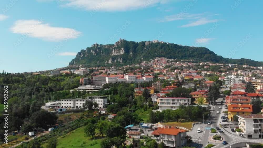 Aerial landscape view from distance on main city rock of San Marino Republic in the background. The concept of the best places for tourism and journey. Down town, Italy Aerial landscape view from distance on main city rock of San Marino Republic in the background. The concept of the best places for tourism and journey. Down town, Italy