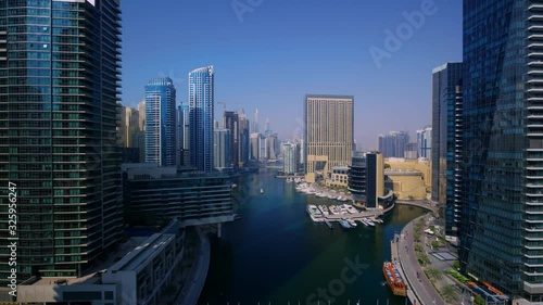 Modern famous urban skyscraper architecture of Dubai downtown cityscape in impressive 4k aerial drone panorama flyover