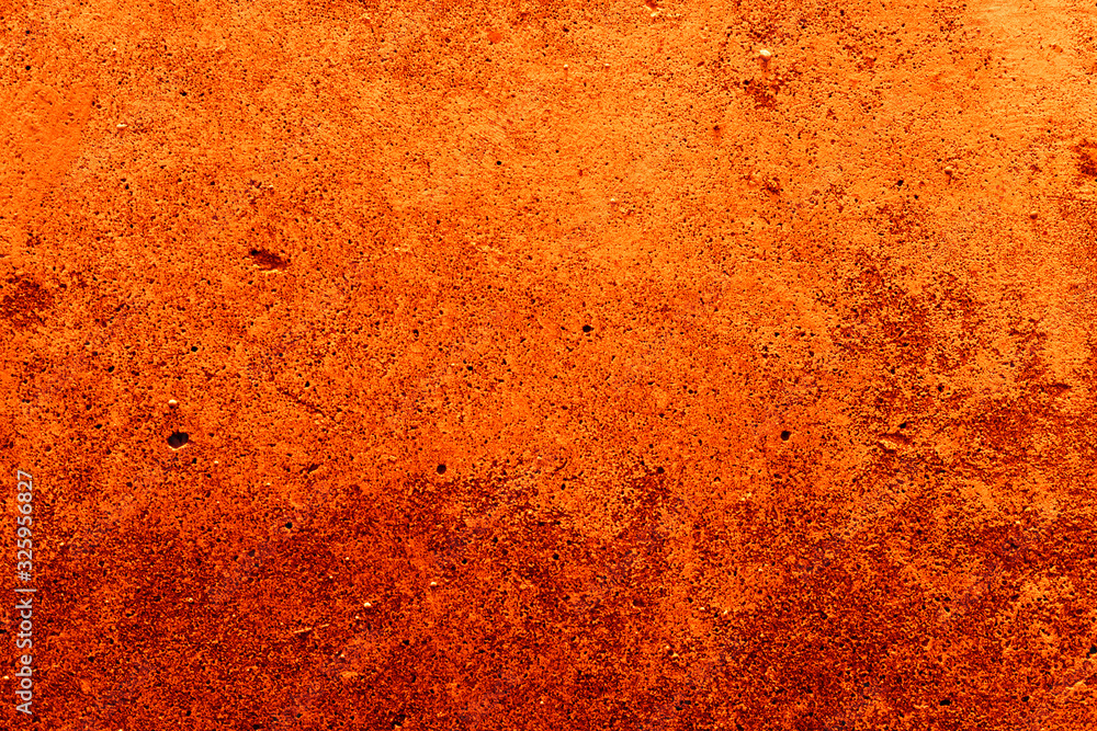Old plaster on the wall. Abstract red-orange background. Old plaster on the wall. Abstract red-orange background.