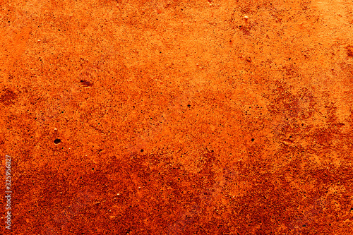 Old plaster on the wall. Abstract red-orange background.