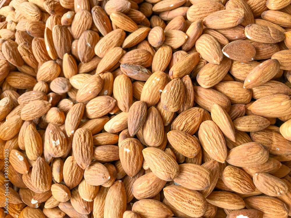 Full Frame Shot Of Raw Almonds. Healthy Fresh Food Background. Full Frame Shot Of Raw Almonds. Healthy Fresh Food Background.