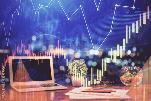 Forex graph hologram on table with computer background. Double exposure. Concept of financial markets.