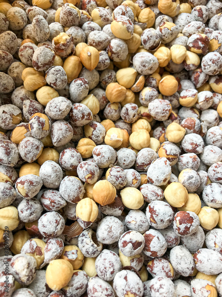 Close-Up Of Peeled Hazelnuts. Healthy Fresh Food Background.
