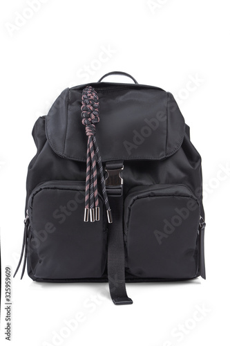 Modern designer backpack made of black textile with zippered pockets, isolated on a white background. Front view.