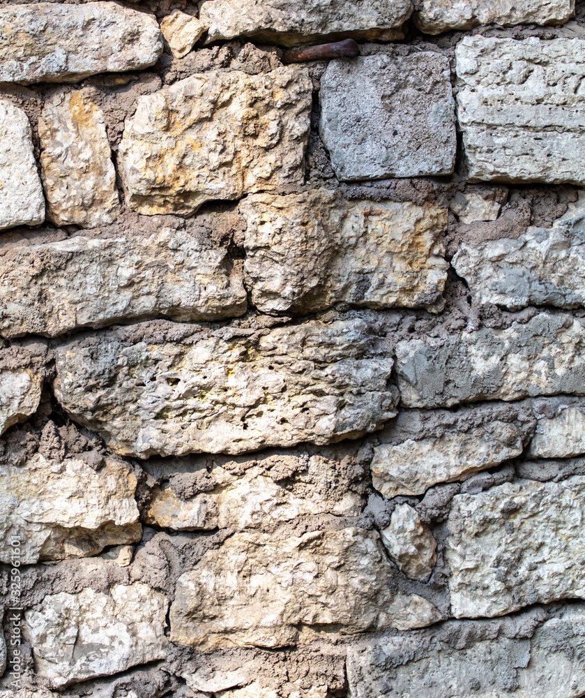 Wall of old stone bricks as a background