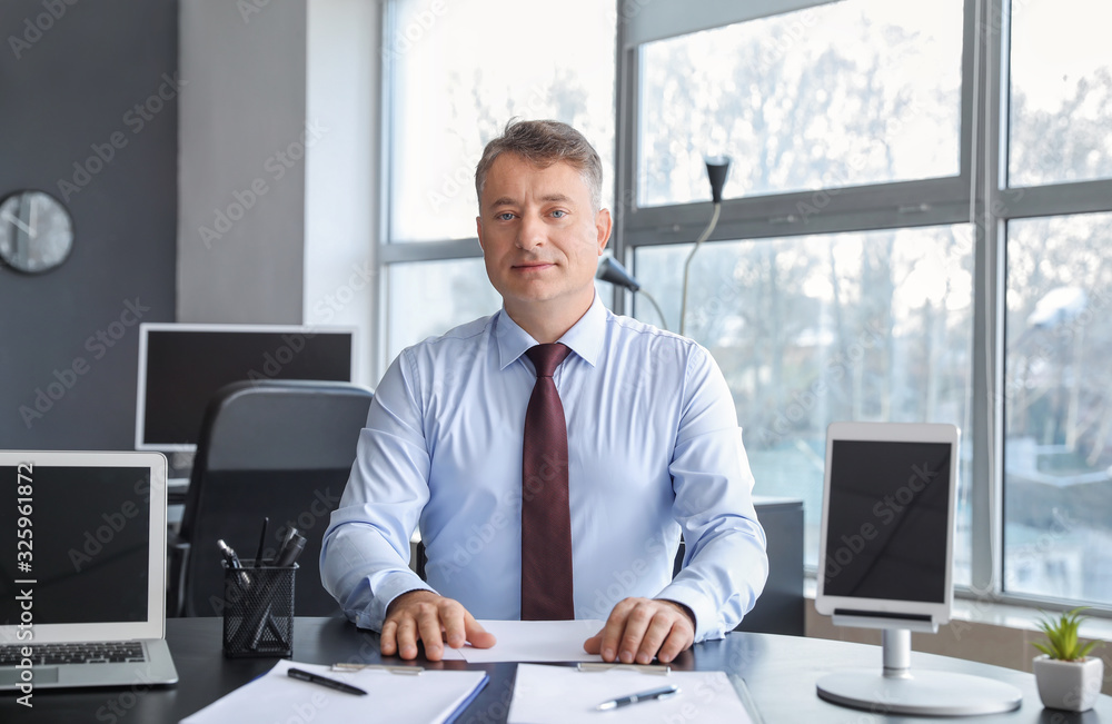 Mature man during job interview in office Mature man during job interview in office