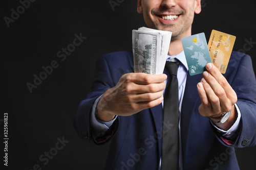 Male bank manager with cred...