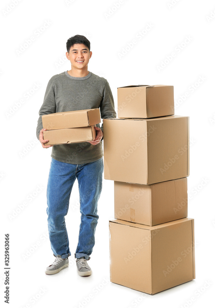 Asian man with moving boxes on white background Asian man with moving boxes on white background