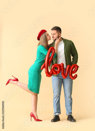 Happy young couple with air...