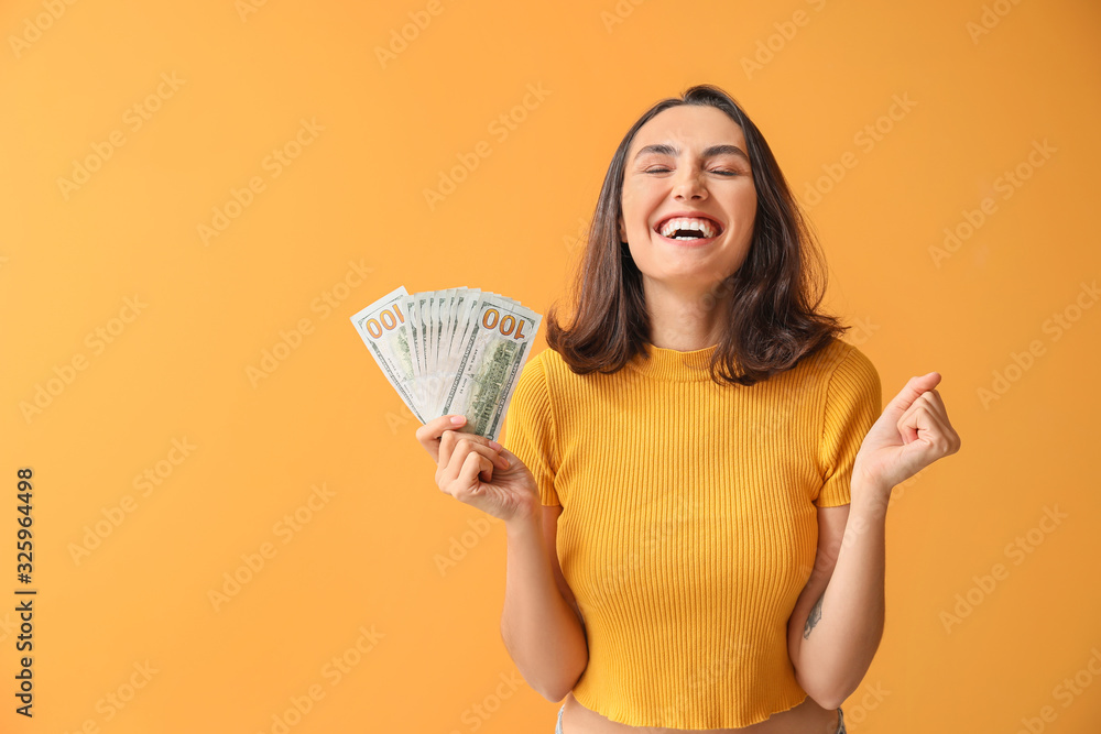 Happy young woman with money on color background Happy young woman with money on color background