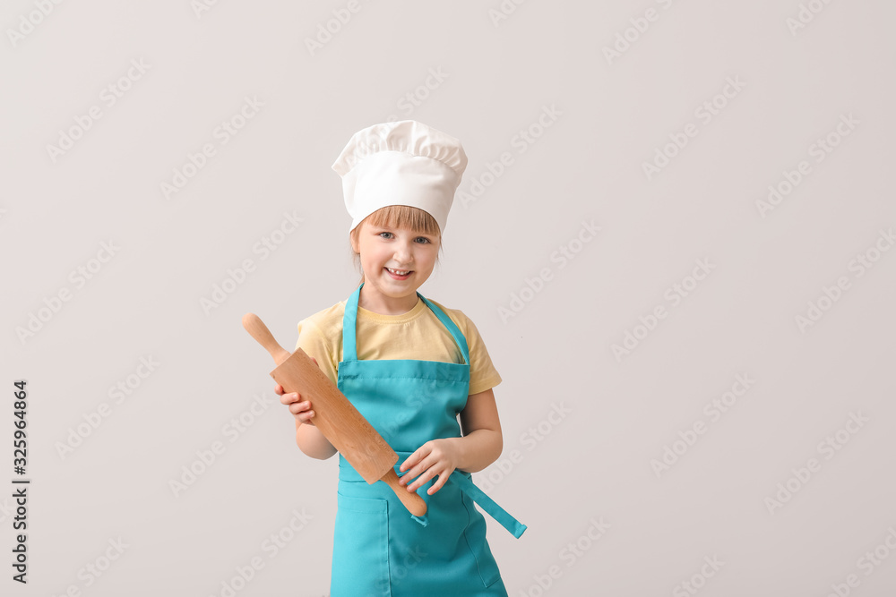 Cute little chef on light background Cute little chef on light background