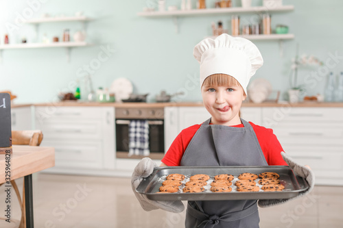 Wallpaper Mural Cute little chef with cookies in kitchen Torontodigital.ca