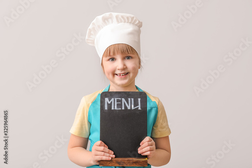 Cute little chef with menu ...