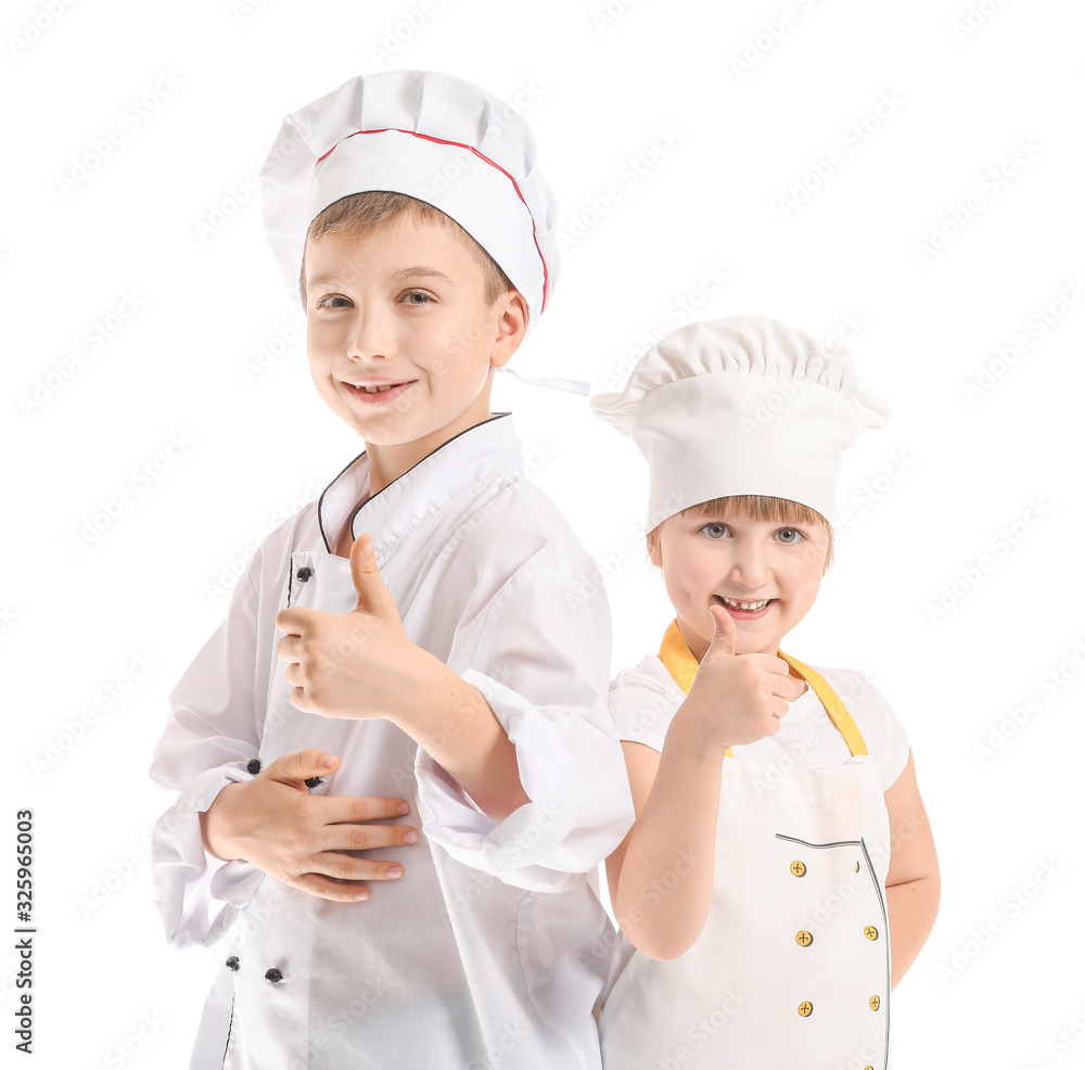 Cute little chefs showing thumb-up on white background Cute little chefs showing thumb-up on white background