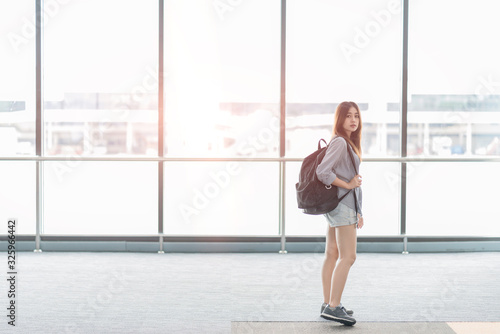 Young women With backpack Waiting A Plane At Terminal Airport 