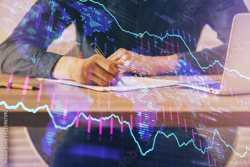 Double exposure hands with stock market chart.