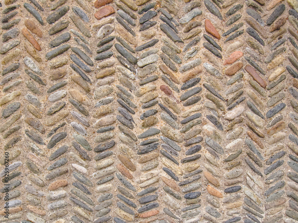 Cobblestone pattern with herringbone ornament closeup Cobblestone pattern with herringbone ornament closeup