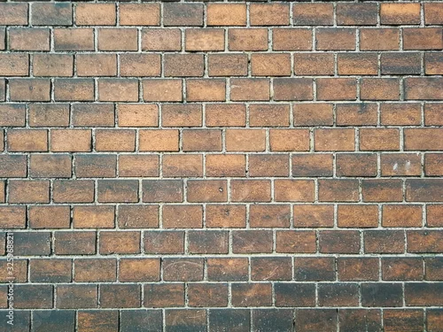 Obraz równo ułożona cegła zabytkowej kamienicy