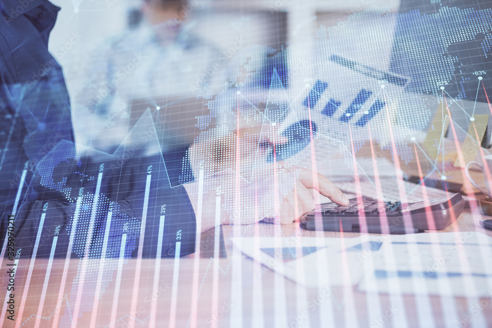 Double exposure of graph with man typing on computer in office on background. Concept of hard work. Closeup. Double exposure of graph with man typing on computer in office on background. Concept of hard work. Closeup.