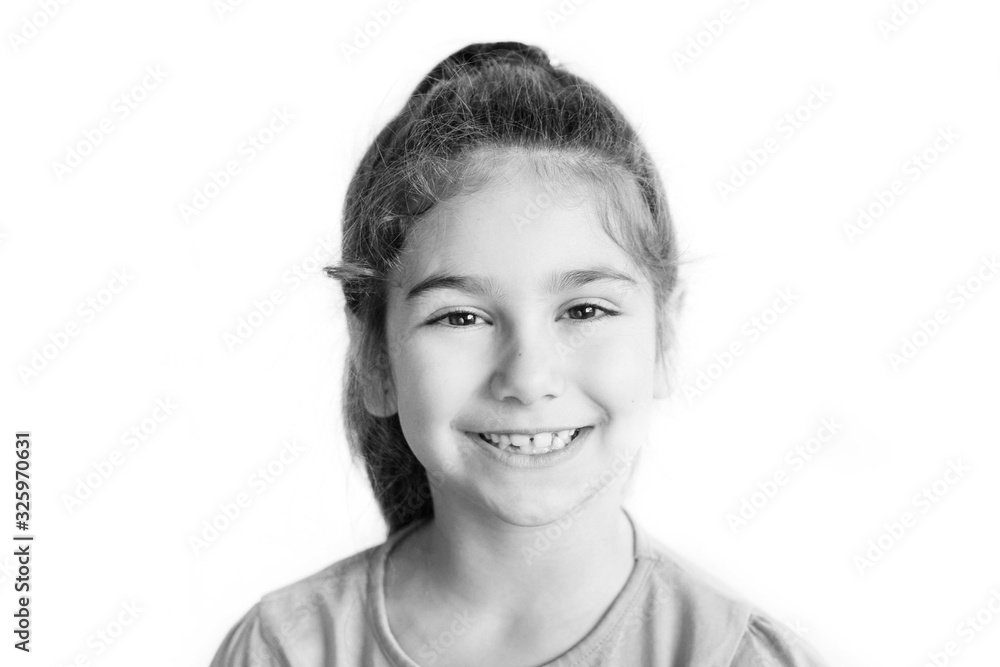 Portrait of happy laughing child girl. Smiling kid. Positive emotions. Black and white image Portrait of happy laughing child girl. Smiling kid. Positive emotions. Black and white image