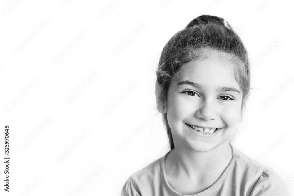 Portrait of happy laughing child girl. Smiling kid. Positive emotions. Black and white image Portrait of happy laughing child girl. Smiling kid. Positive emotions. Black and white image