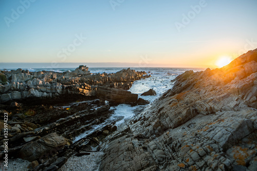 sunset on coast of sea