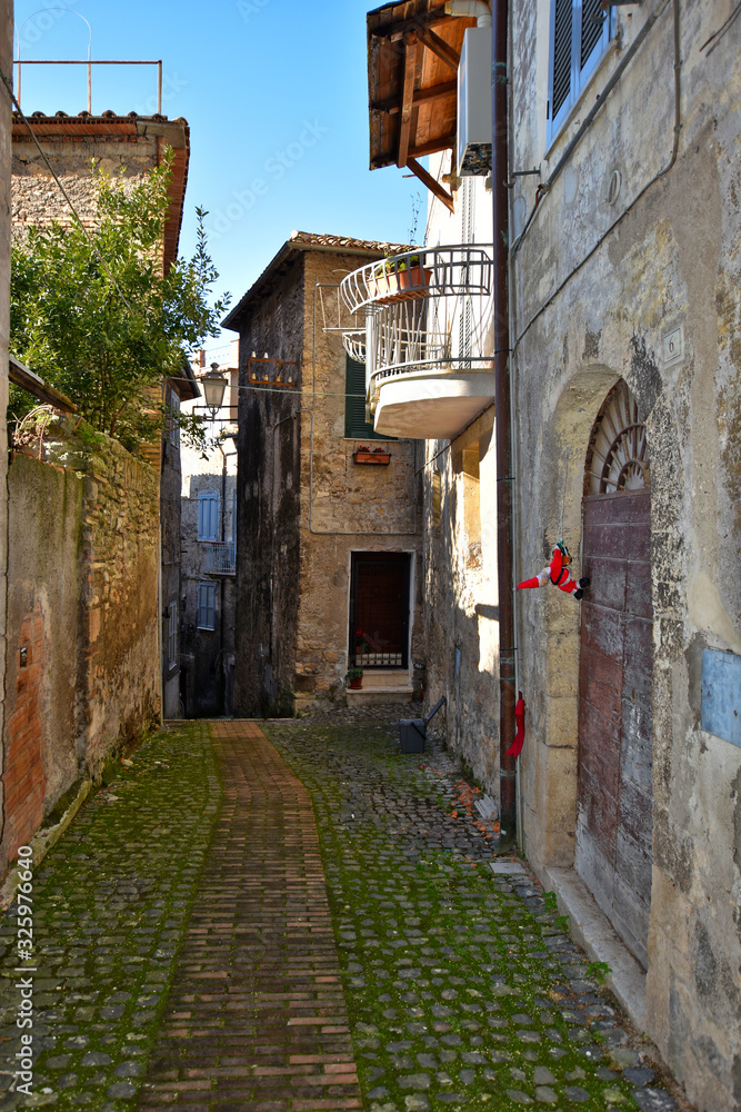 Anagni, Italy, A narrow street between the old stone houses of a medieval village.