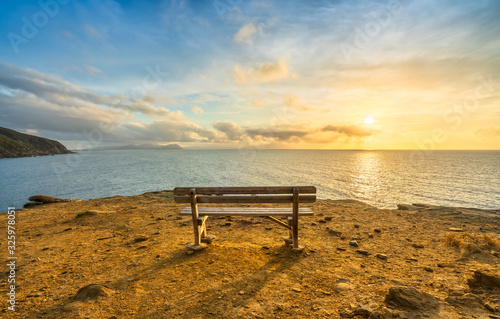 Fototapeta Naklejka Na Ścianę i Meble -  Bench in Populonia cliff Buca delle Fate. Piombino, Maremma Tuscany, Italy.
