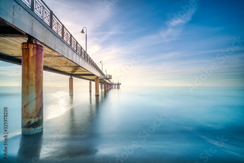 Fototapeta Naklejka Na Ścianę i Meble -  Pier or jetty, beach and sea in Marina di Pietrasanta. Versilia Tuscany Italy