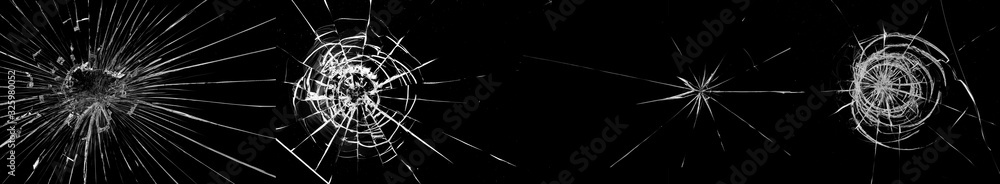 Fototapeta premium Round white cracks in glass on black background.