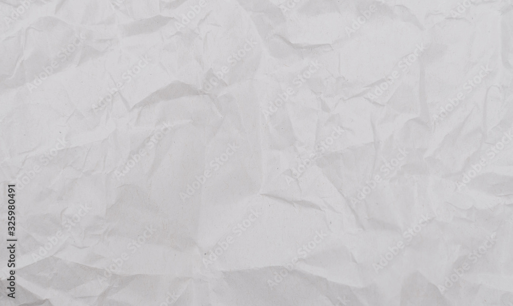 Obraz premium White crumpled paper texture background. Close-up.