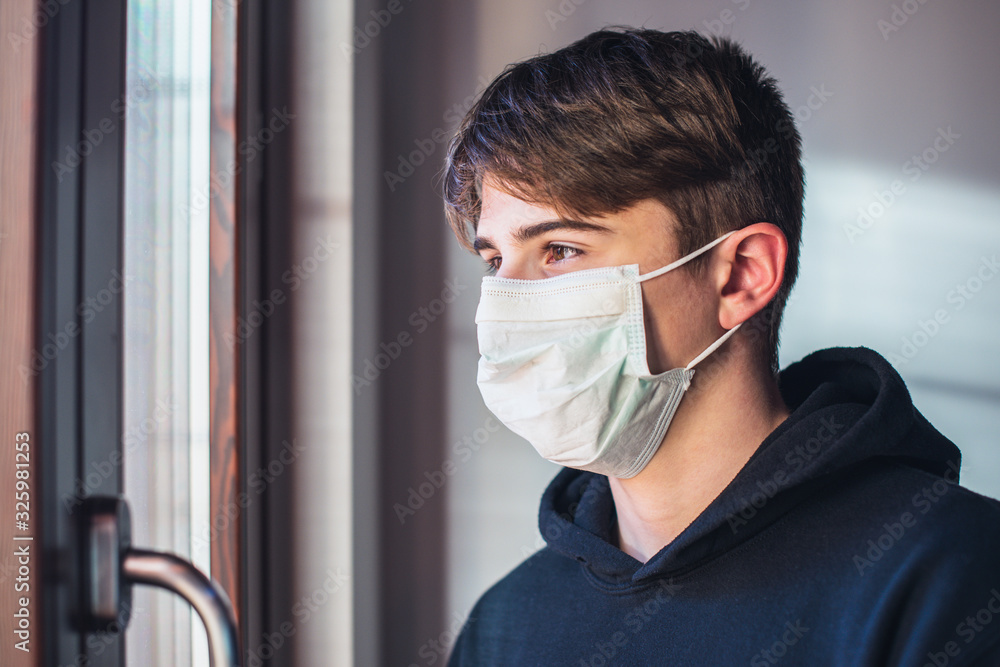 young boy with protective mask - pandemic infection fear concept - quarantine at home - stay at home - obrazy, fototapety, plakaty 