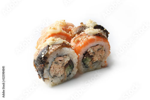 Sushi with salmon, roll with grilled salmon, cucumber, mushrooms served with mayonnaise and sesame.