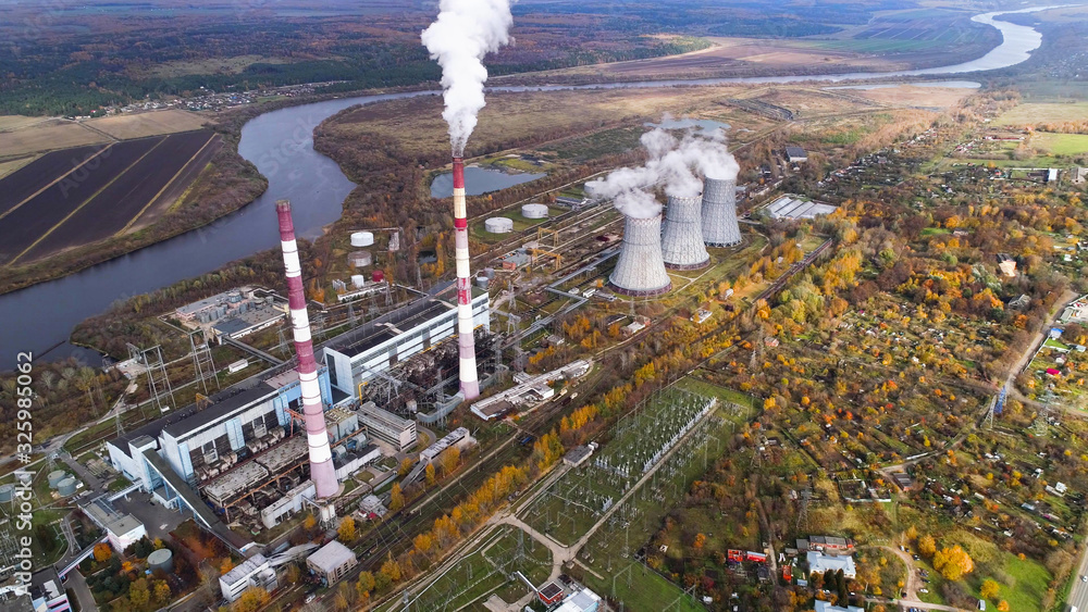 An energy station that generates heat and electric energy for heating and lighting urban homes. Aerial view. An energy station that generates heat and electric energy for heating and lighting urban homes. Aerial view.
