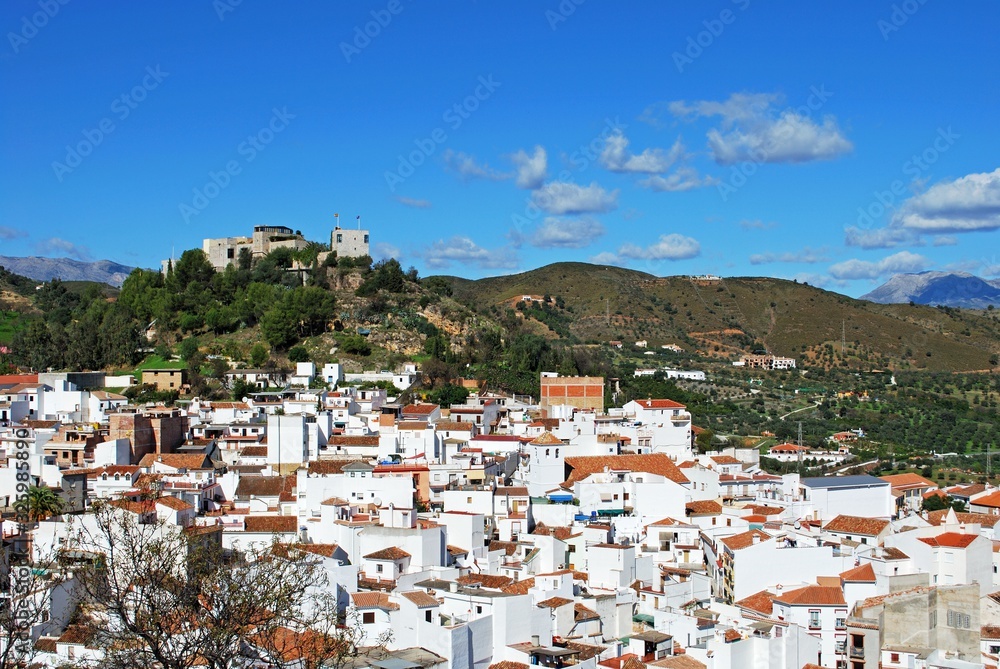 General view of the town with the castle on the hilltop, Monda, Spain.