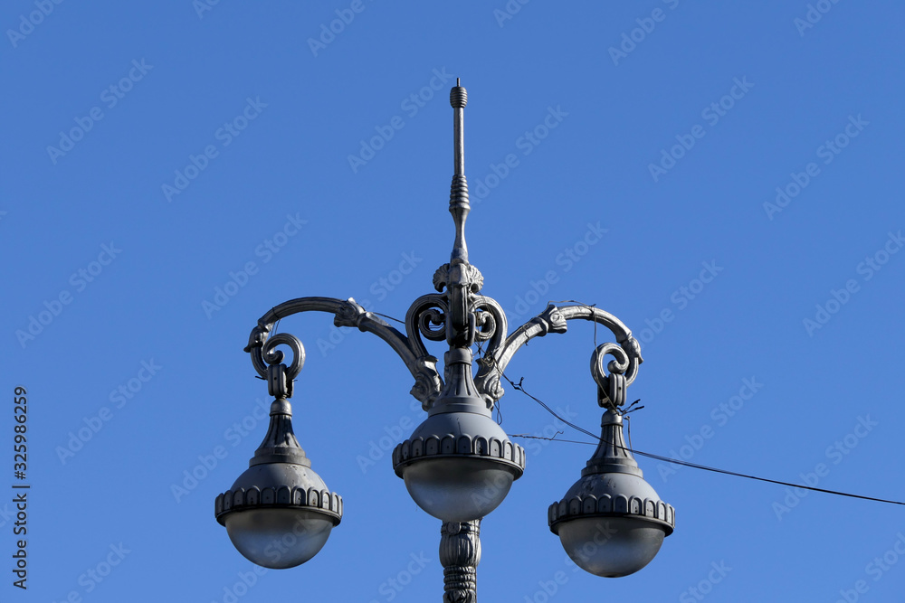 Gray old style retro street lamps and blue sky Gray old style retro street lamps and blue sky