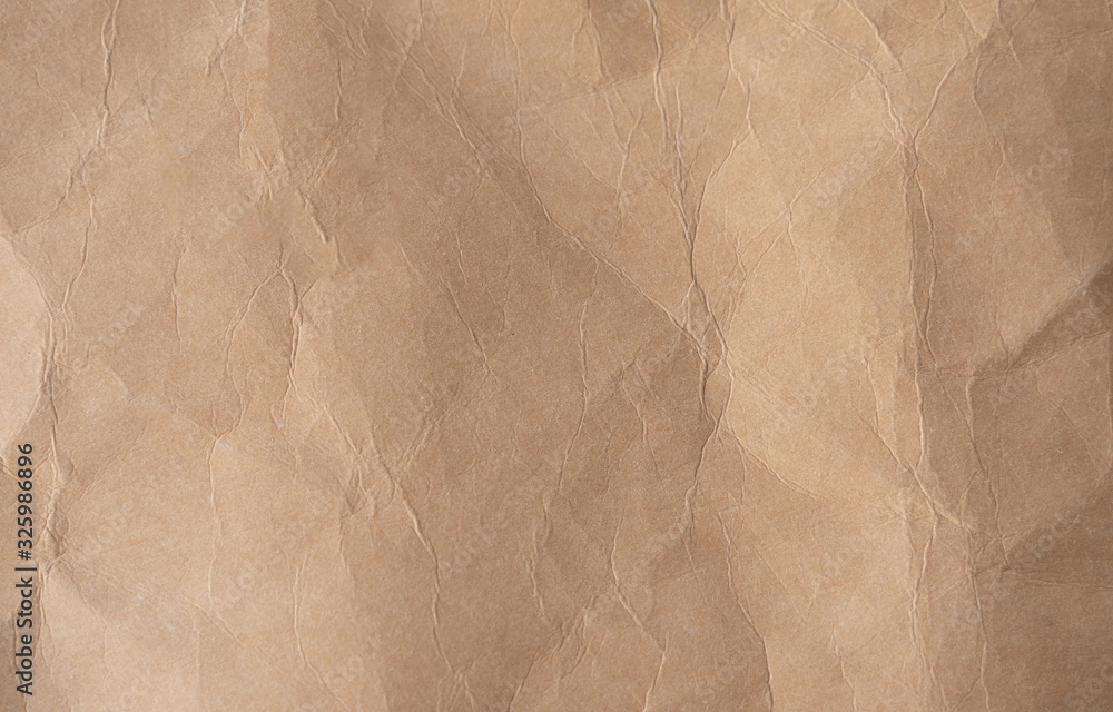 Fototapeta premium Brown crumpled paper texture background.