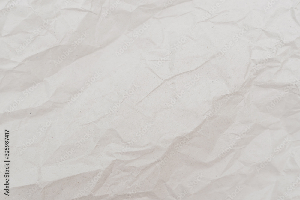 Obraz premium White crumpled paper texture background. Close-up.